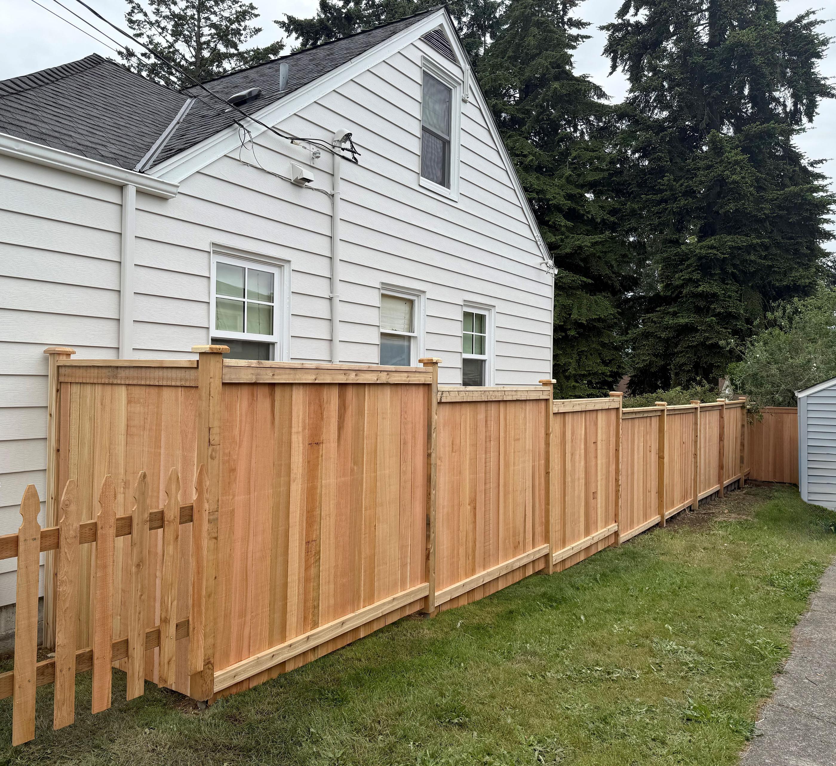 wood privacy fence installed by top rail fence