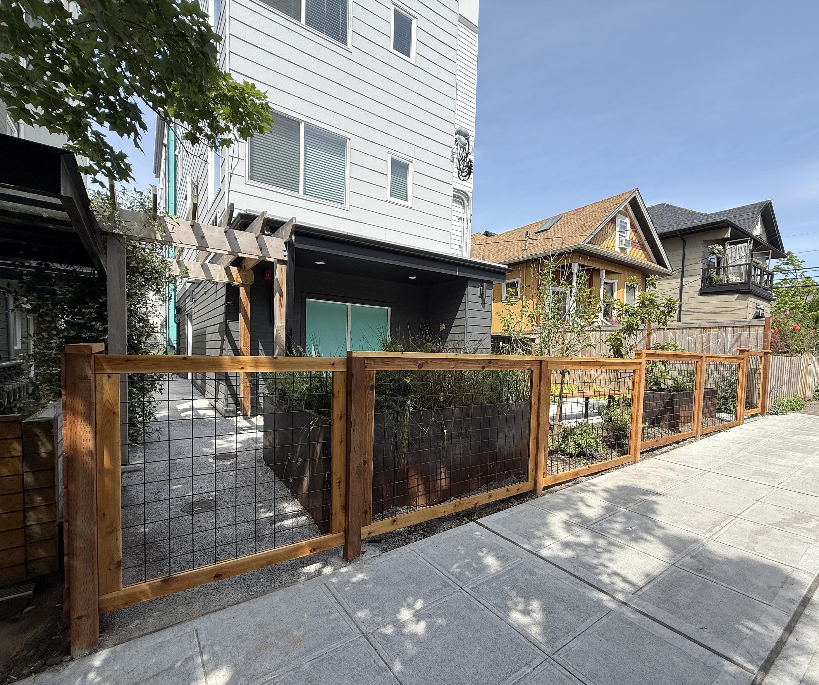 wood hogwire fence installed by top rail fence