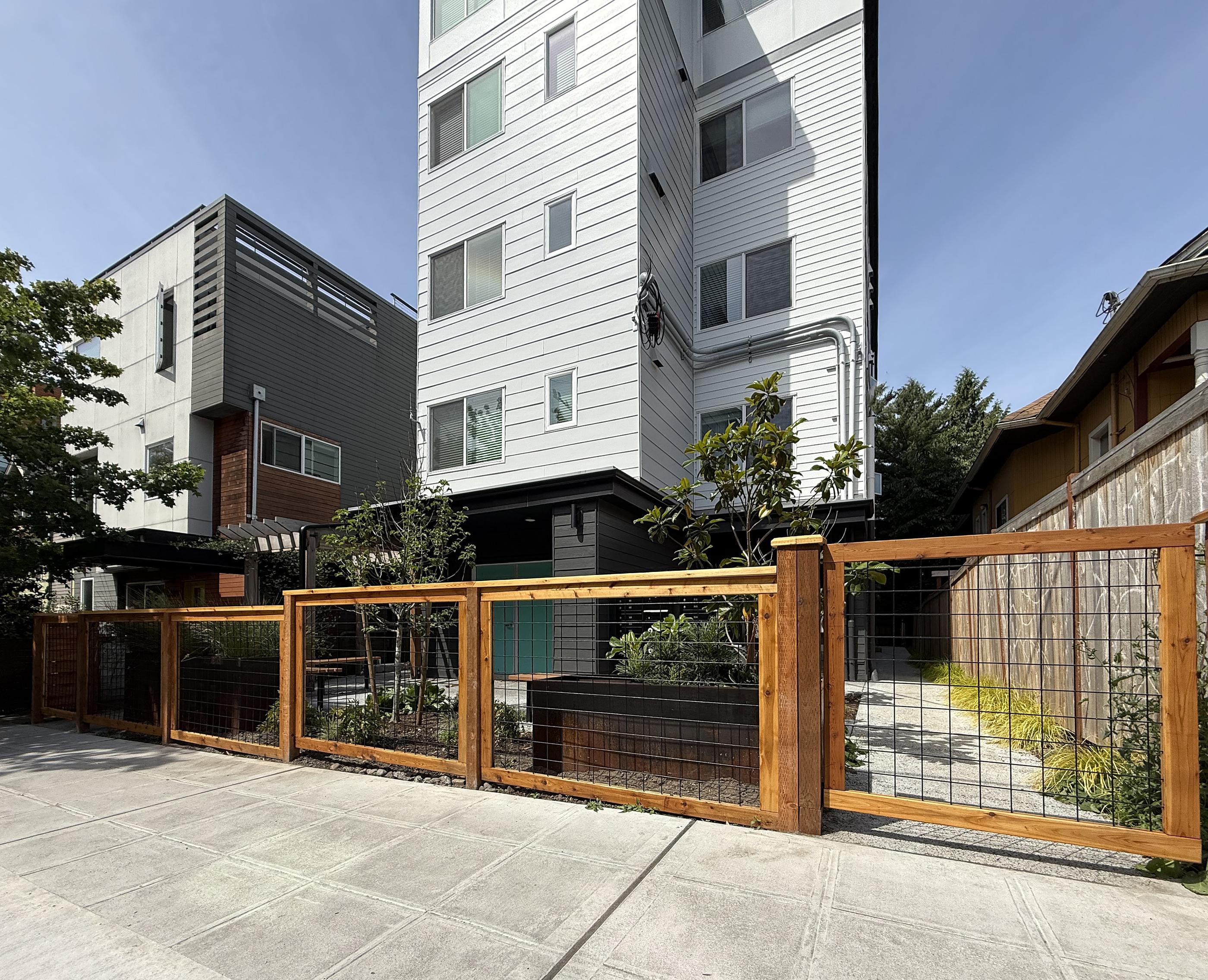 wood hogwire installed by top rail fence
