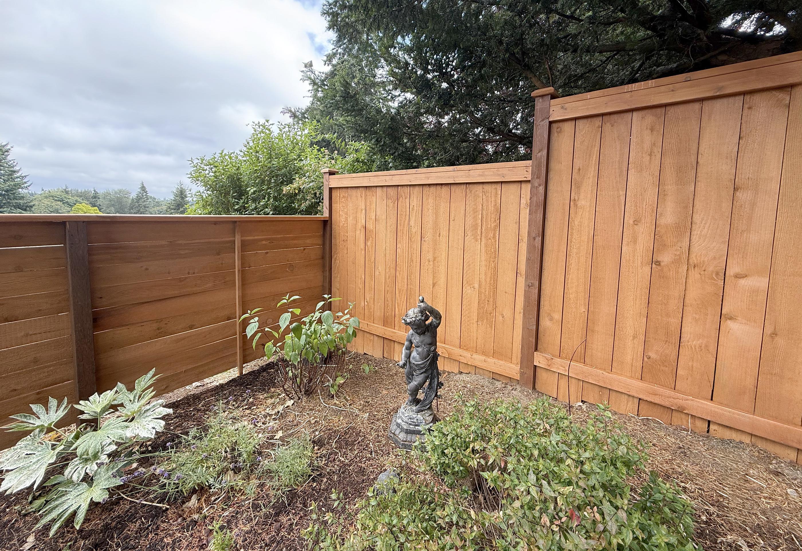 wood cap and trim fence installed by top rail fence