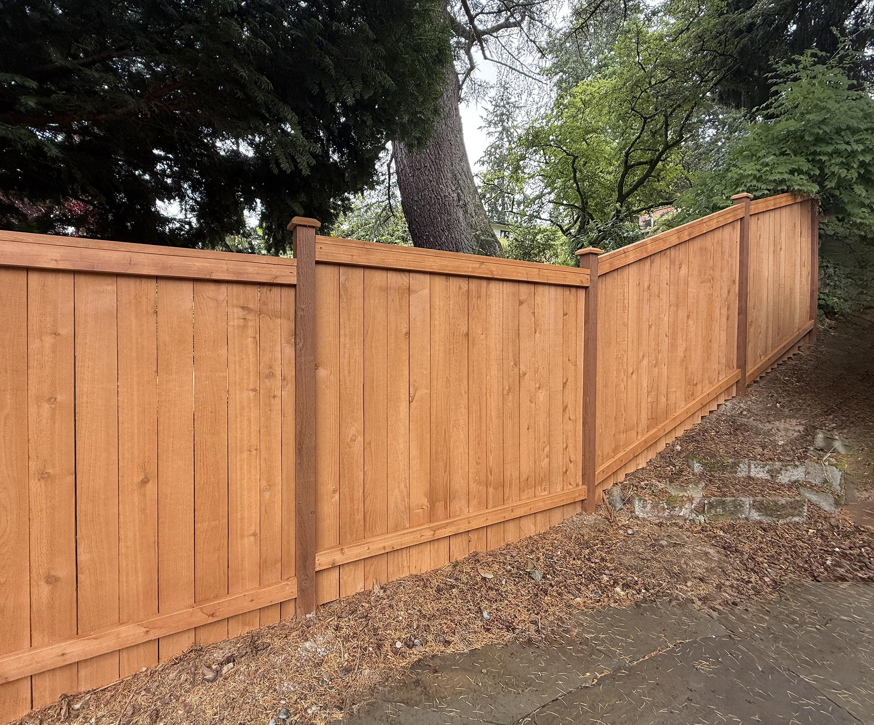 wood cap and trim fence installed by top rail fence