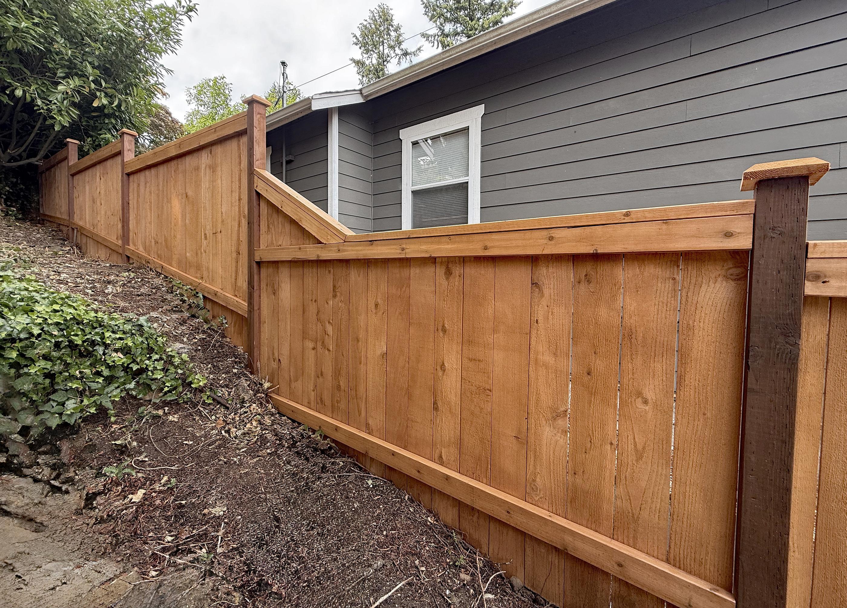 wood cap and trim fence installed by top rail fence
