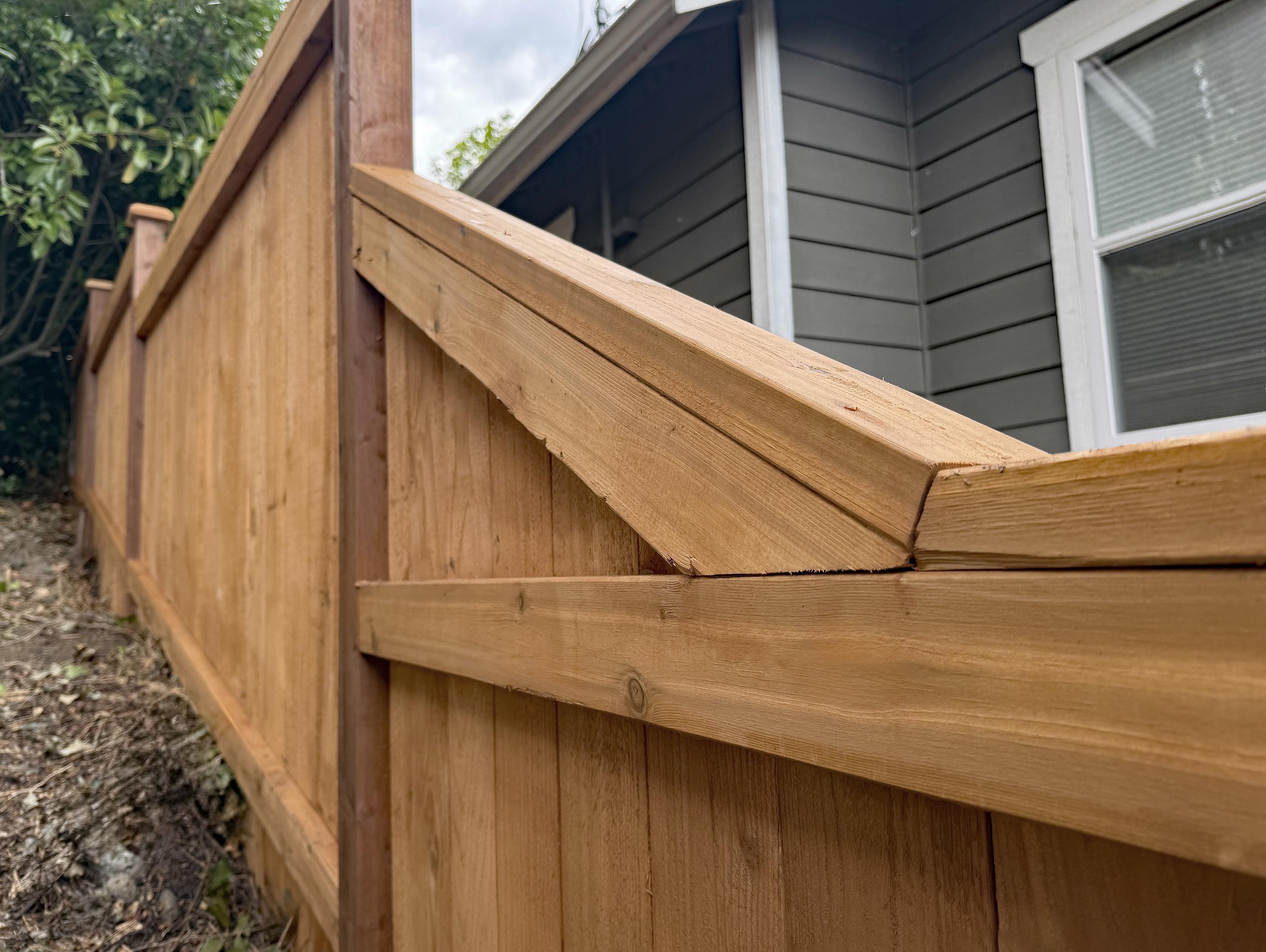 wood cap and trim fence installed by top rail fence