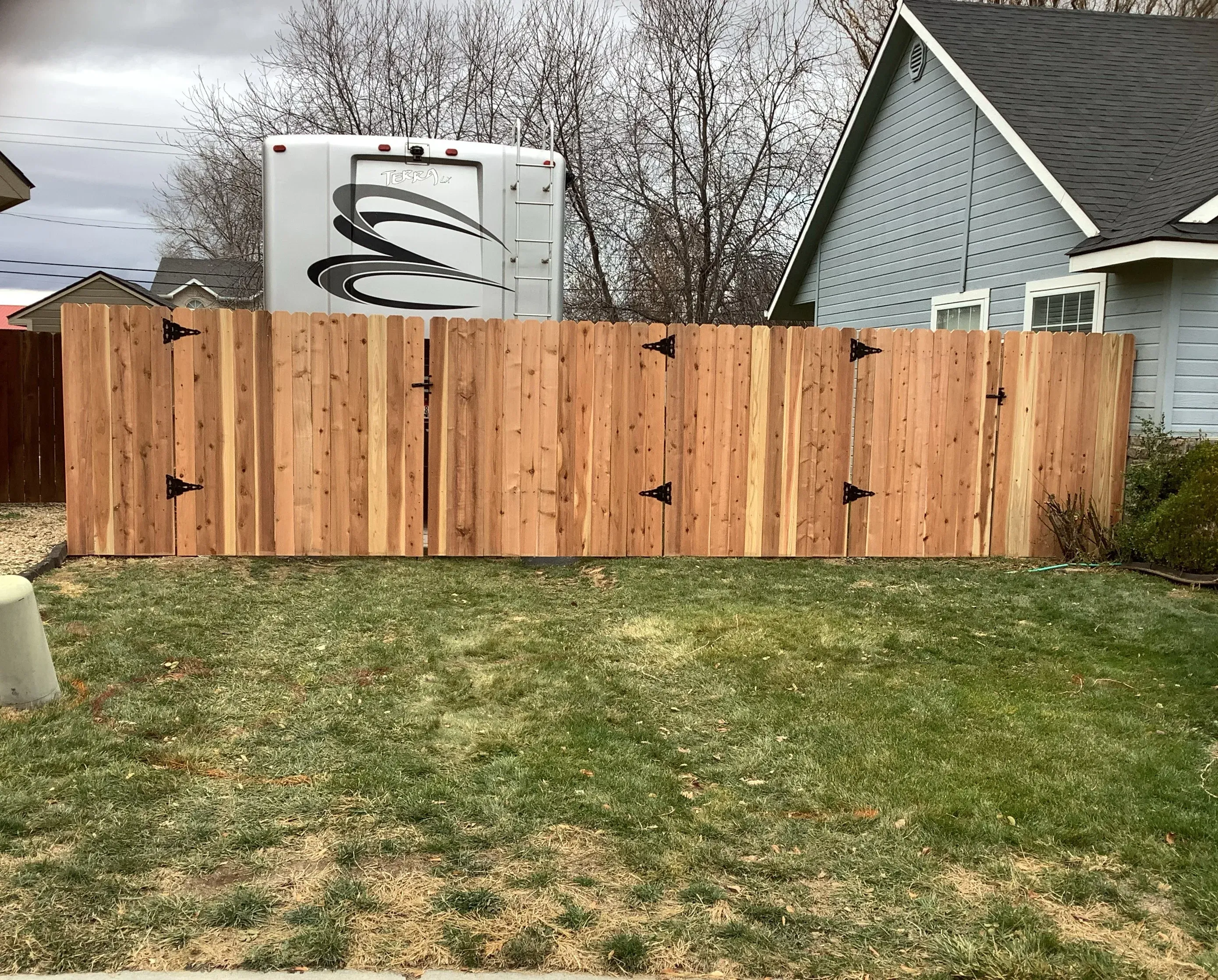 wood stockade fence installed by top rail fence