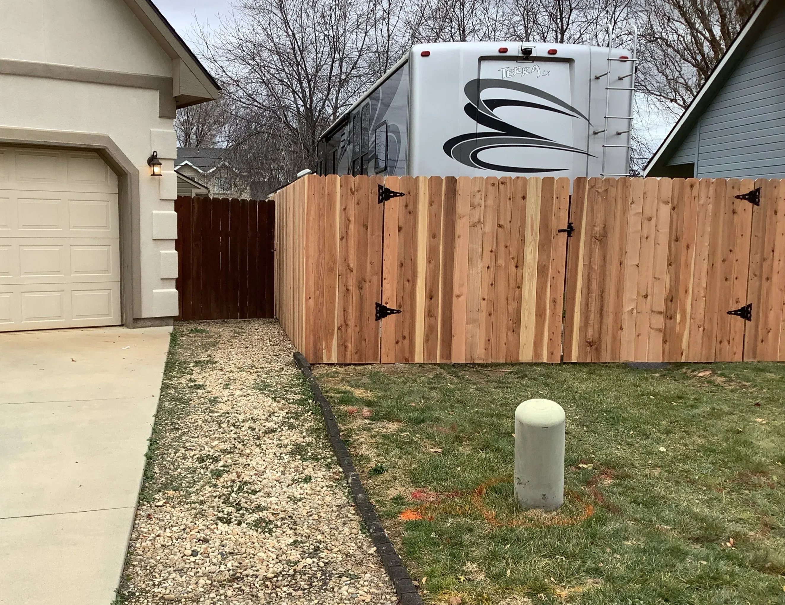 wood stockade fence installed by top rail fence