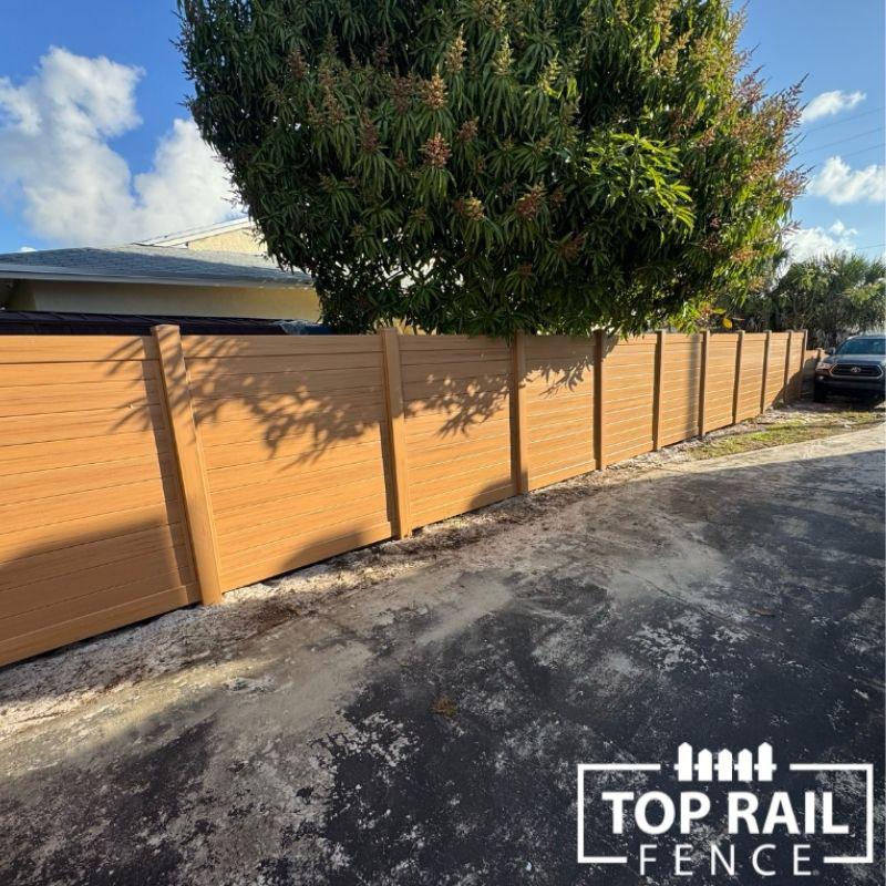 Vinyl cypress color pirvacy fence installed by Top Rail Fence