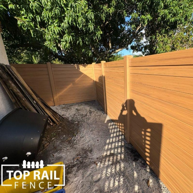 Vinyl cypress color pirvacy fence installed by Top Rail Fence