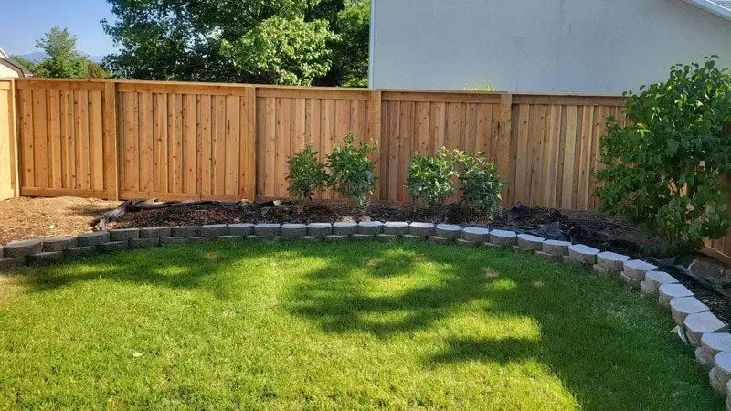 wood fence installed by top rail fence