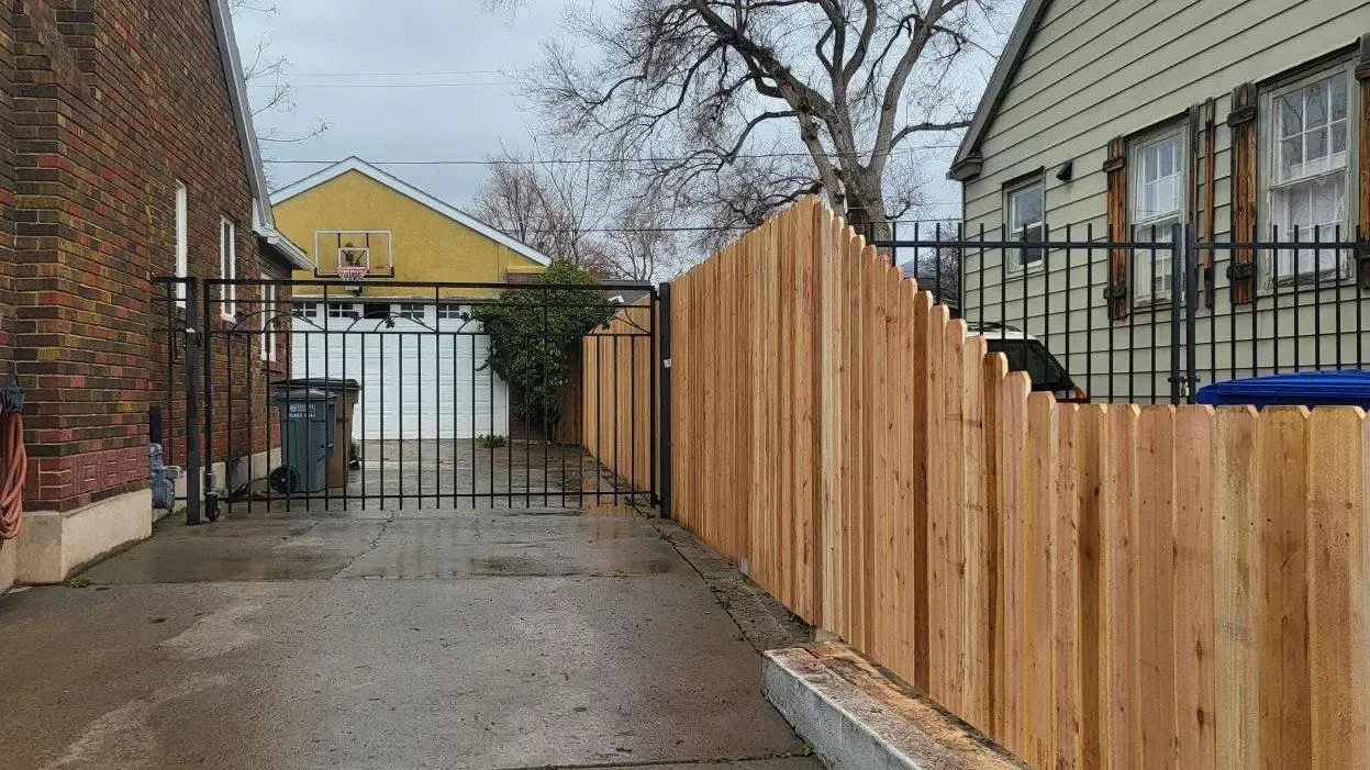 wood stockade fence installed by top rail fence