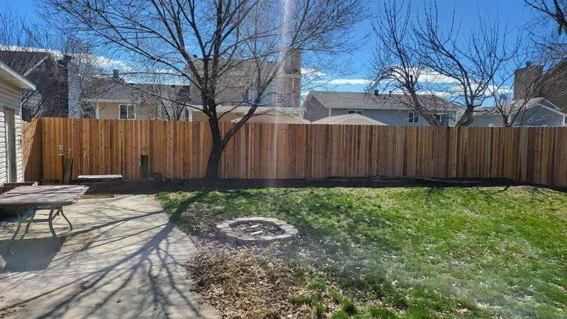 wood stockade fence installed by top rail fence