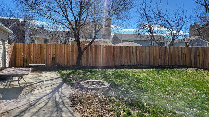 wood stockade fence installed by top rail fence