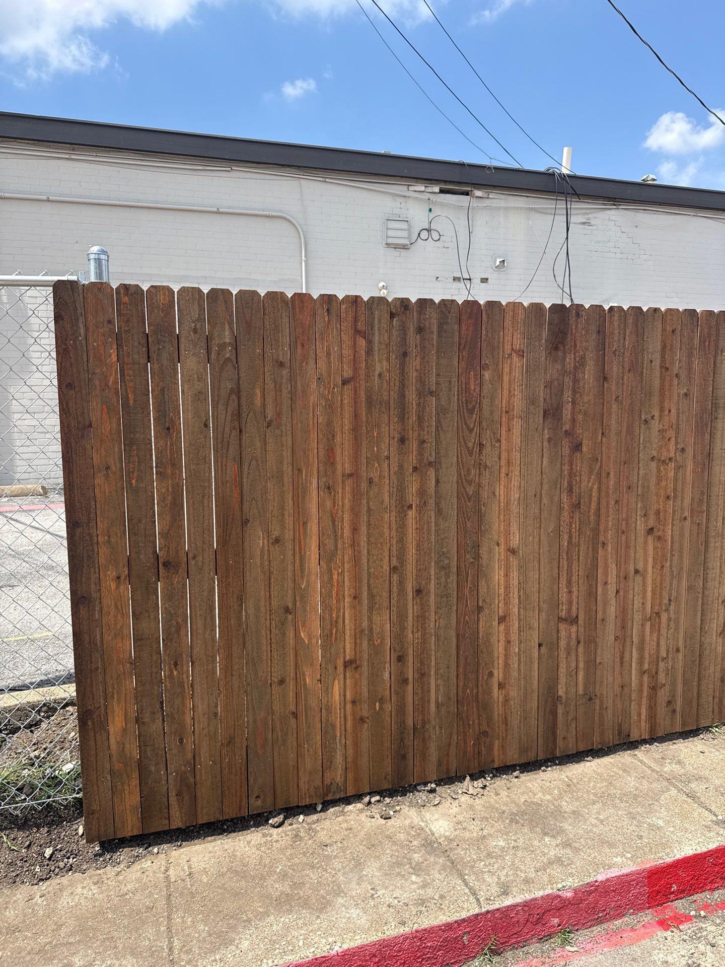 commercial fence installed by top rail fence