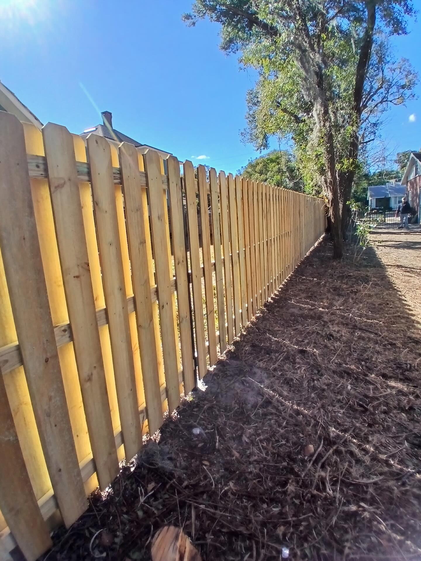 wood shadowbox fence installed by top rail fence