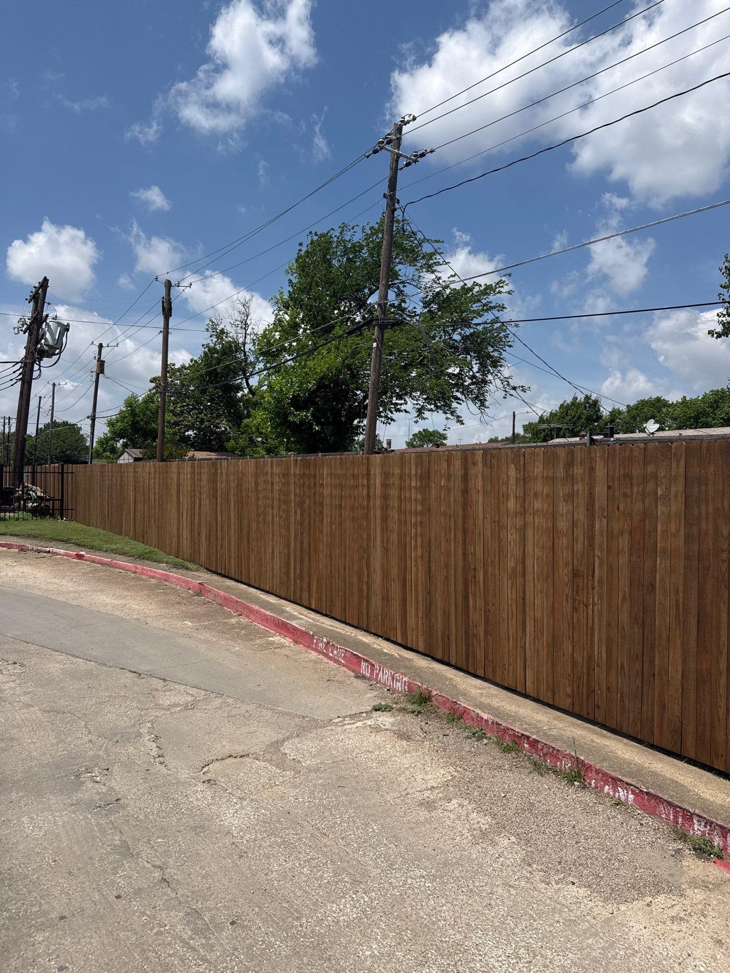 commercial fence installed by top rail fence