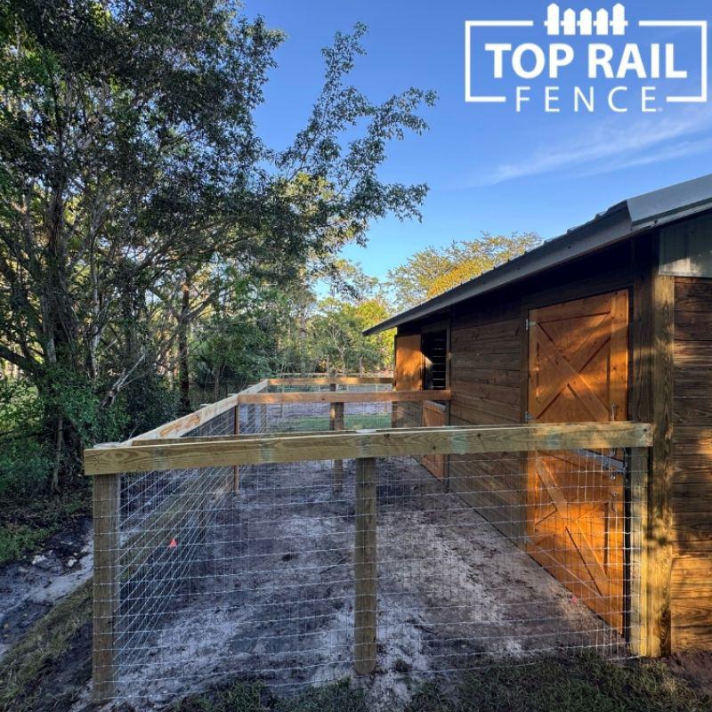 home with a no climb horse wire fence installed by Top Rail Fence