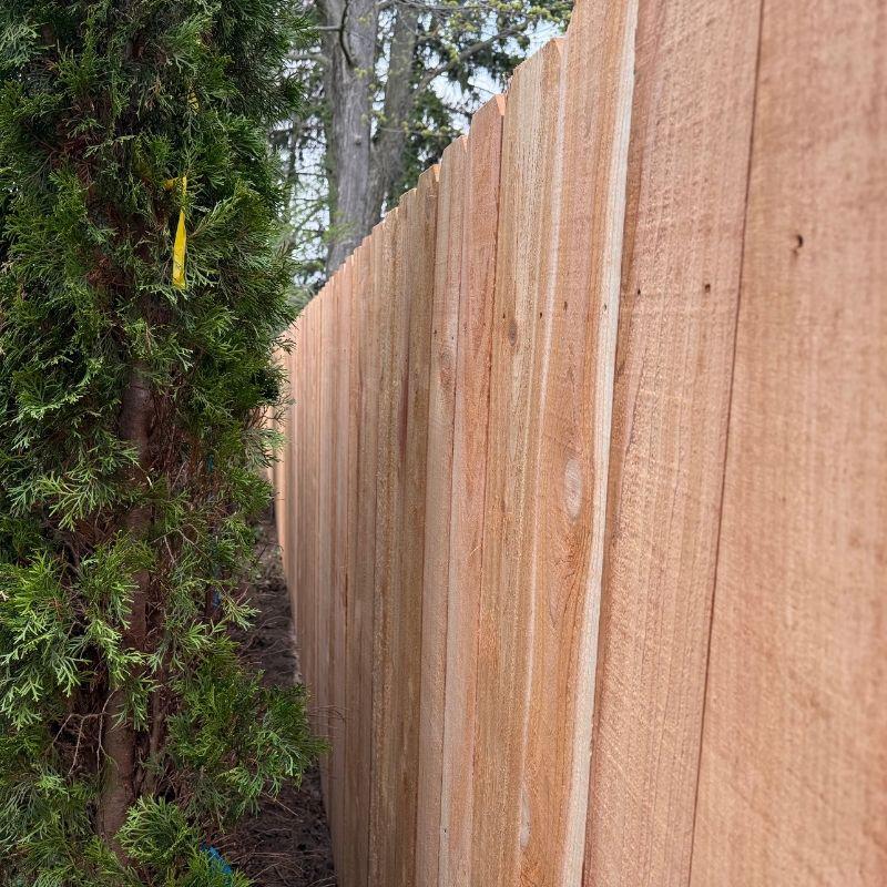 cedar stockade fence installed by top rail fence