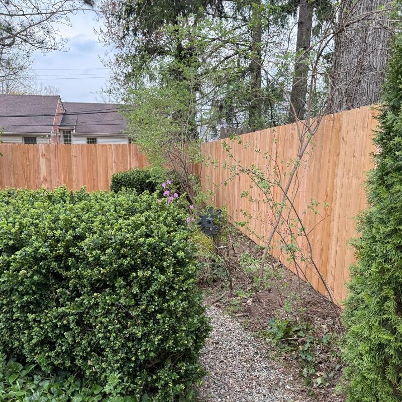 cedar stockade fence installed by top rail fence