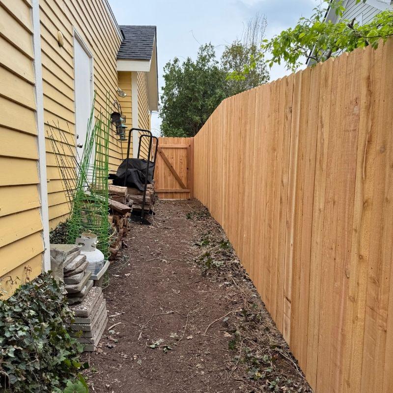 cedar stockade fence installed by top rail fence