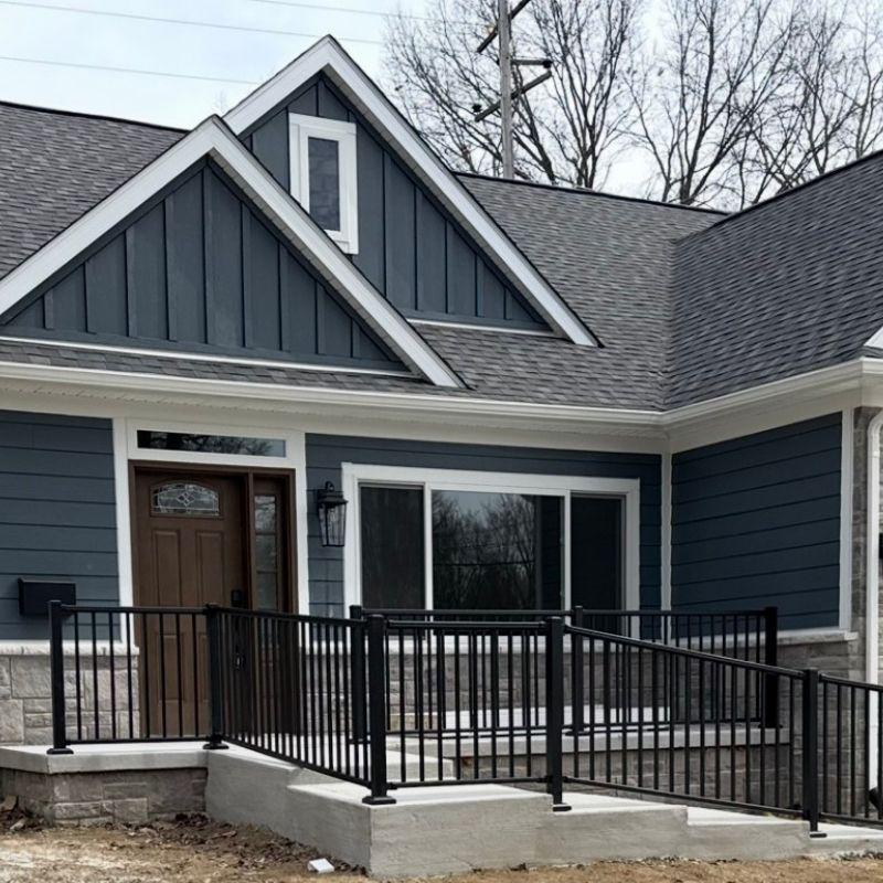ornamental metal handrail installed by top rail fence