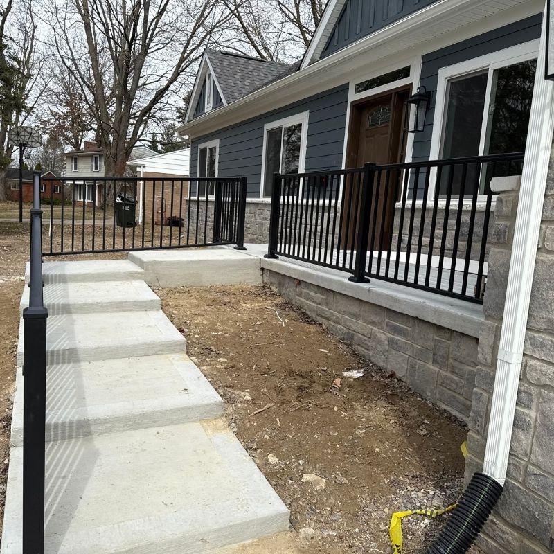 ornamental metal handrail installed by top rail fence