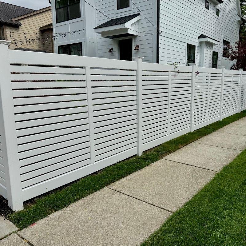 Horizontal composite fence installed by Top Rail Fence