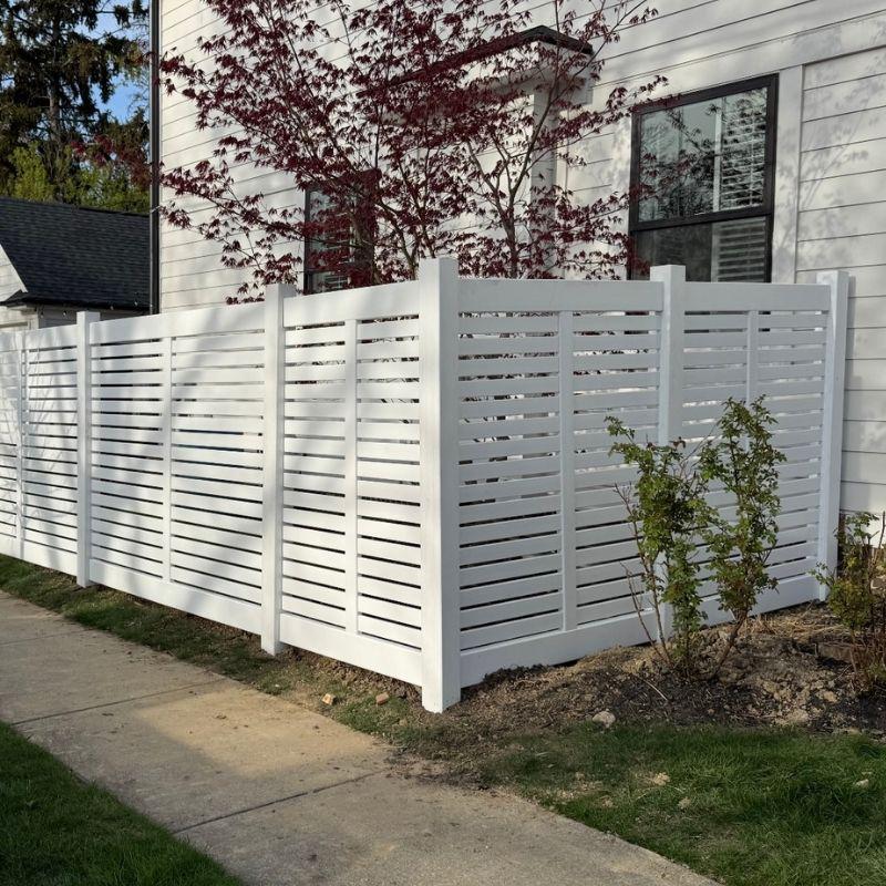 Horizontal composite fence installed by Top Rail Fence