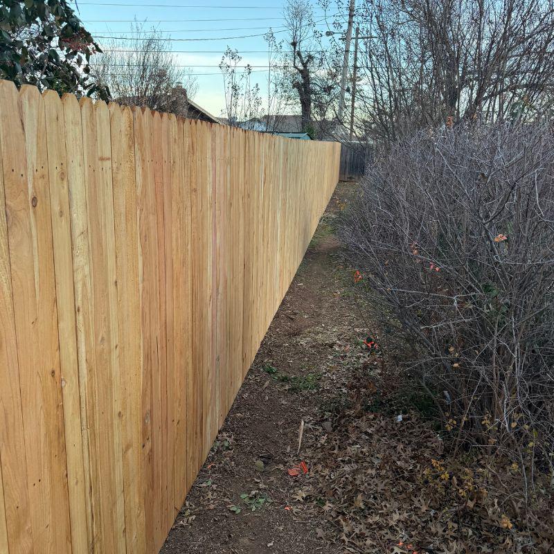 wood stockade fence installed by top rail fence oklahoma city
