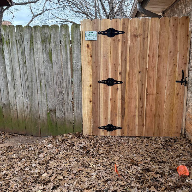 stockade fence installed by top rail fence