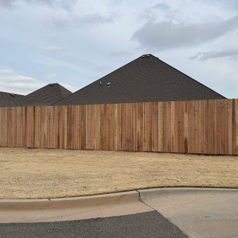 wood stockade fence installed by top rail fence