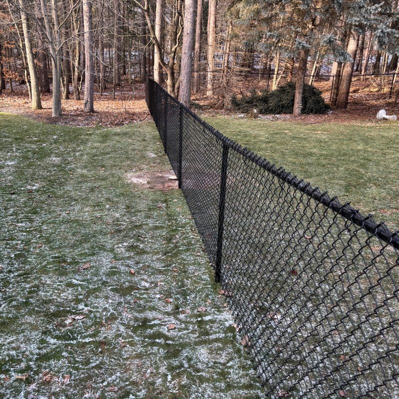 chain link fence installed by top rail fence