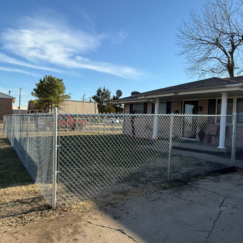 galvanized chain link fence installed by top rail fence