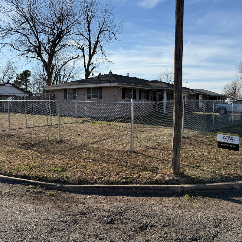 galvanized chain link fence installed by top rail fence