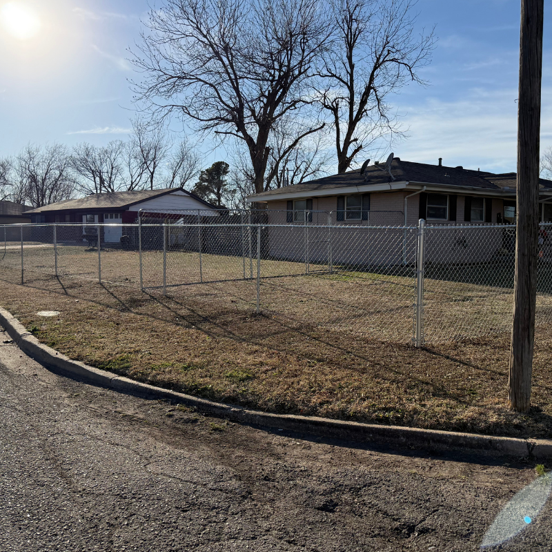 galvanized chain link fence installed by top rail fence