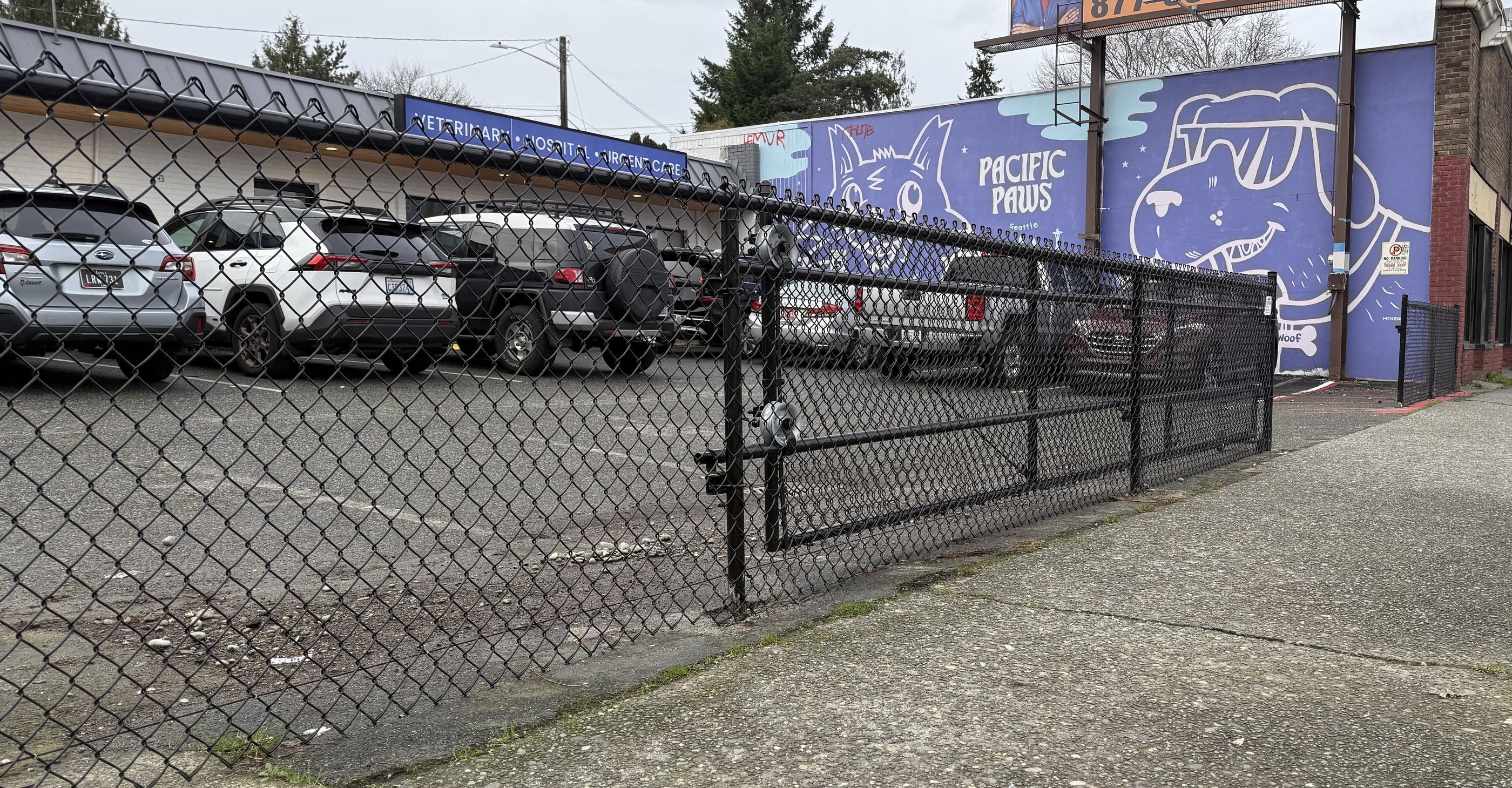 commercial black chain link fence installed by top rail fence