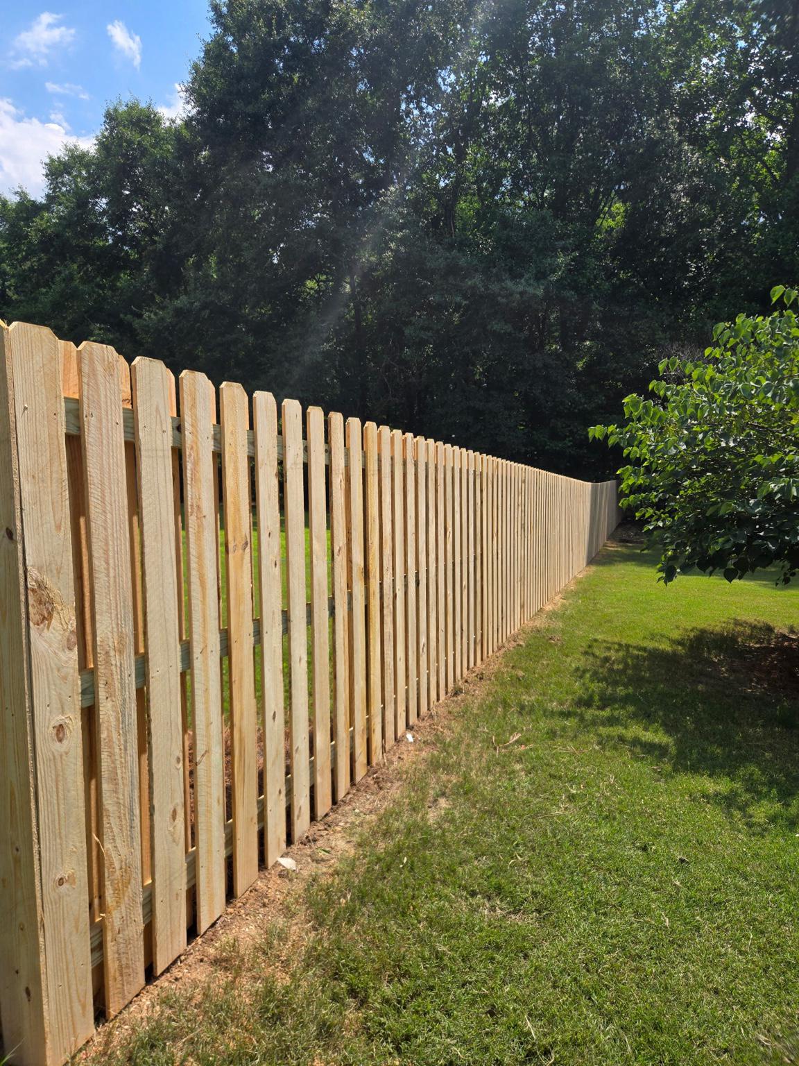 wood shadowbox fence installed by top rail fence