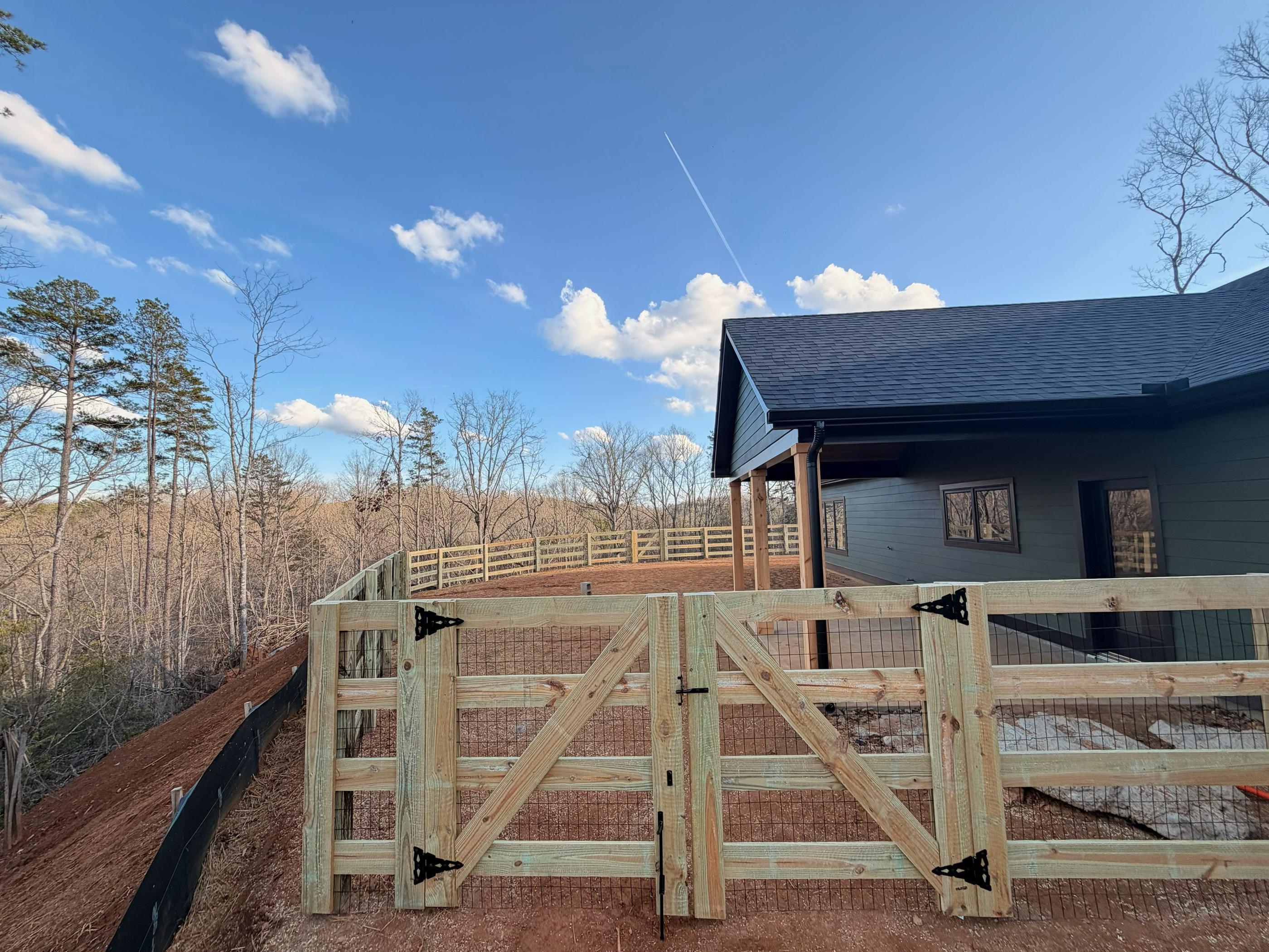 wood ranch rail fence installed by top rail fence