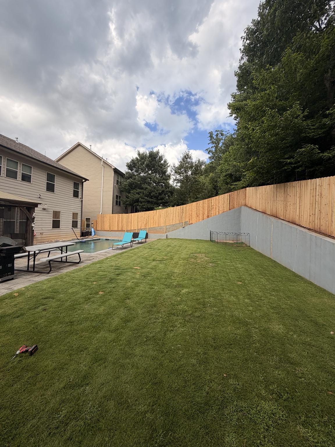 wood stockade fence installed by top rail fence
