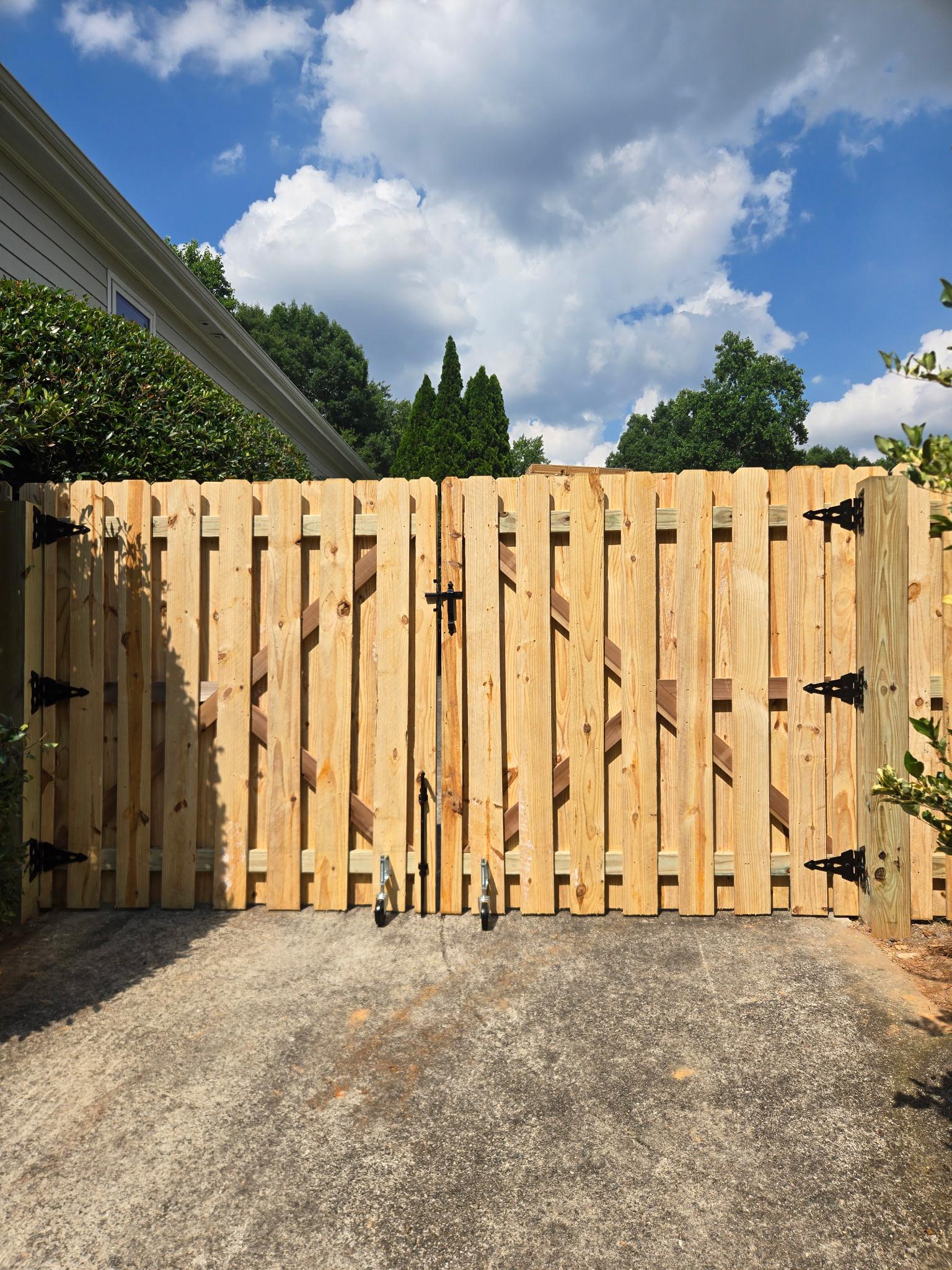 wood shadowbox fence installed by top rail fence