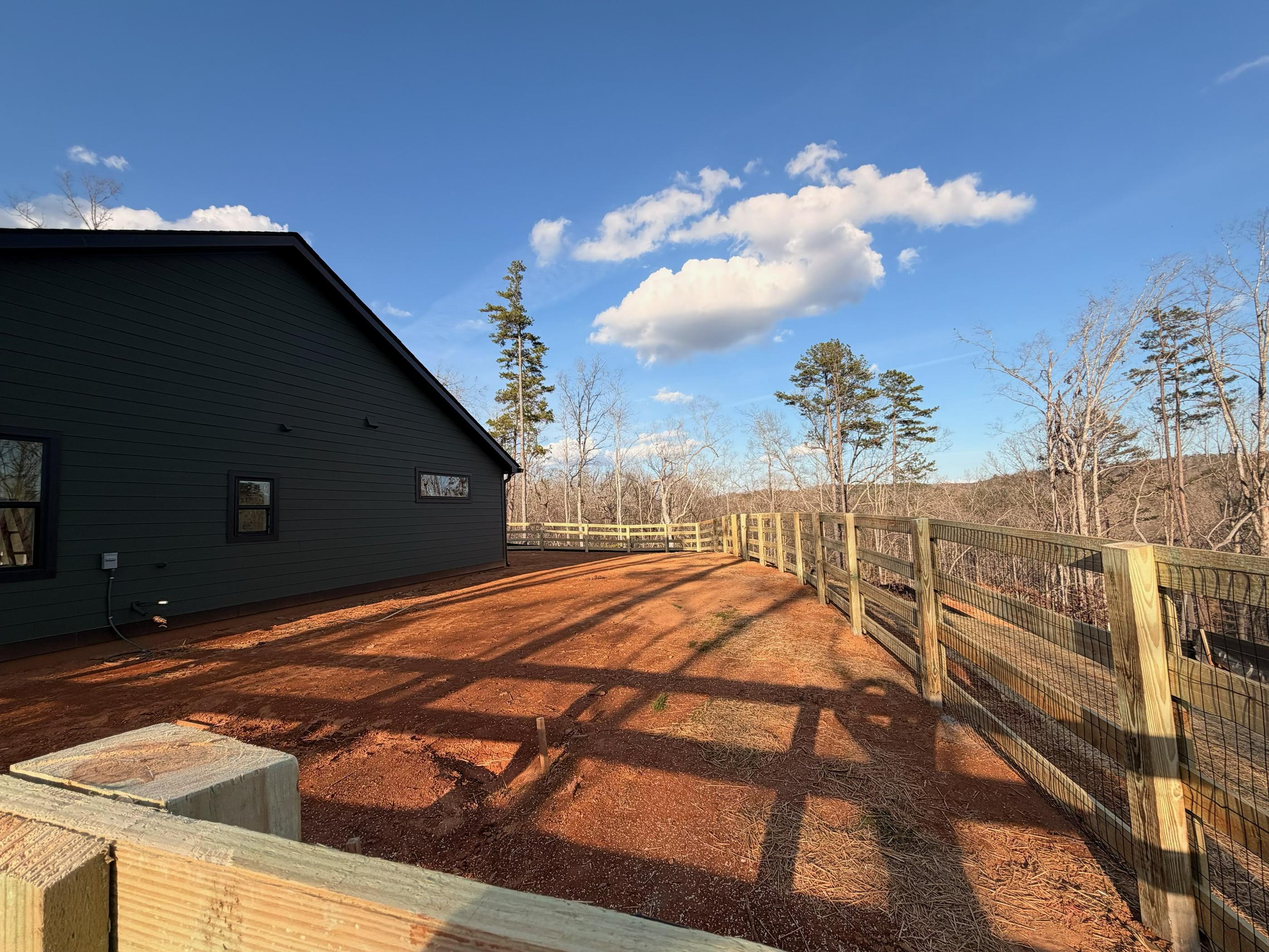 wood ranch rail fence installed by top rail fence