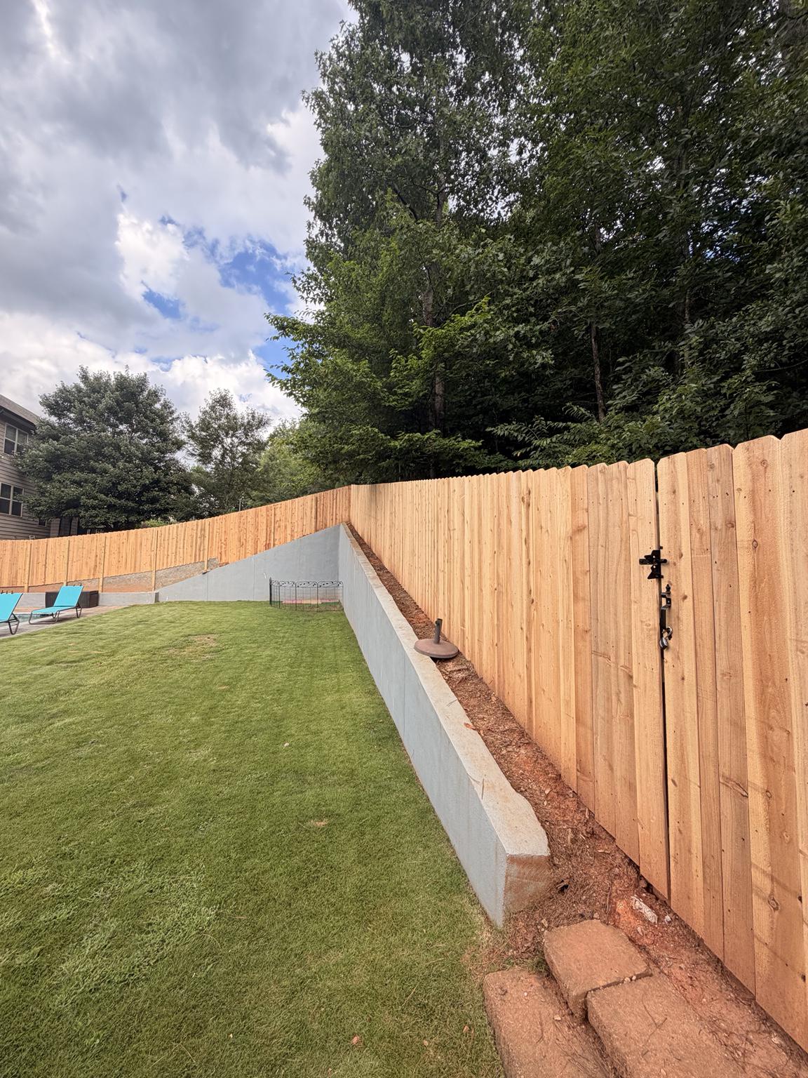 wood stockade fence installed by top rail fence