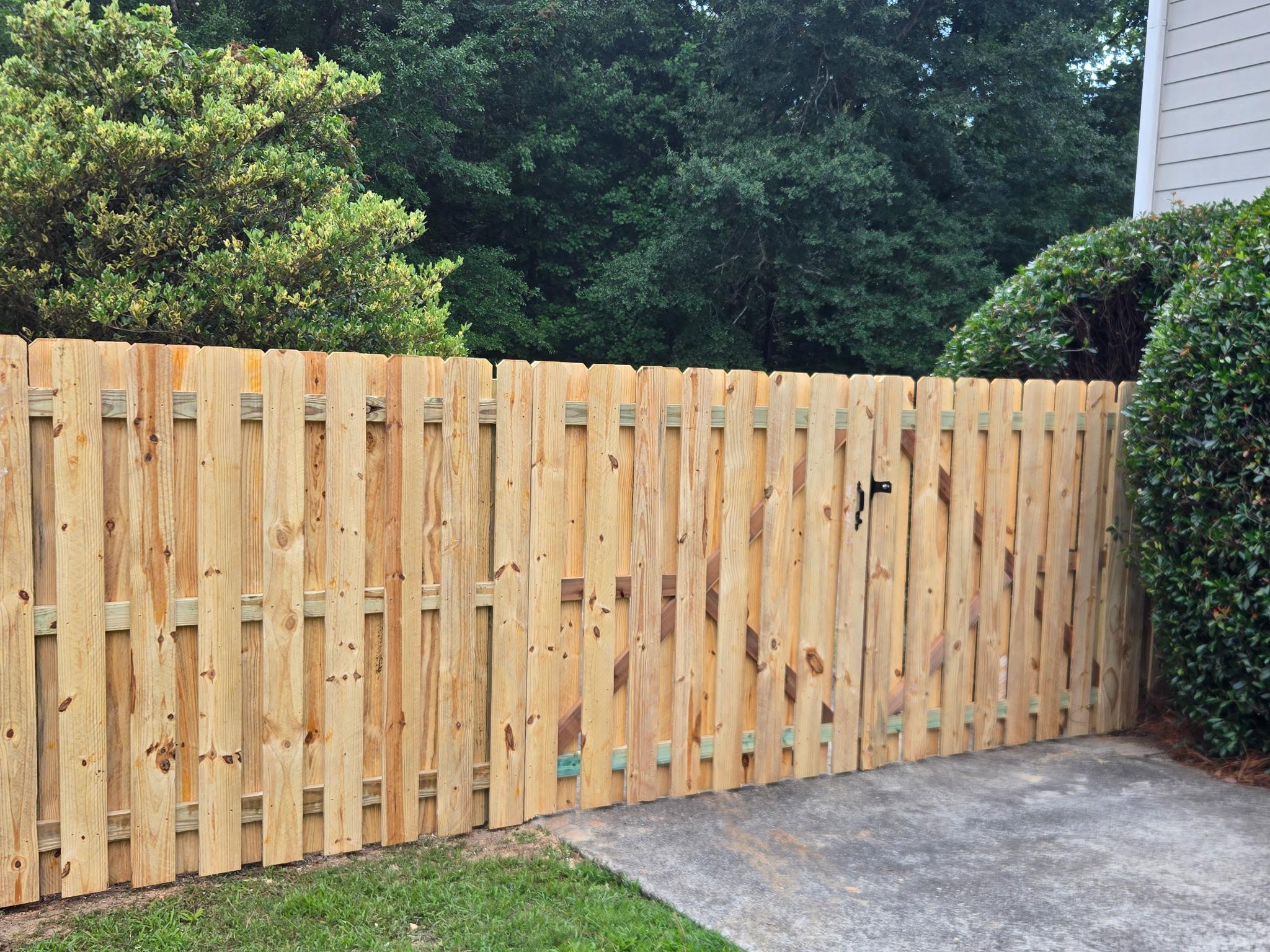 wood shadowbox fence installed by top rail fence