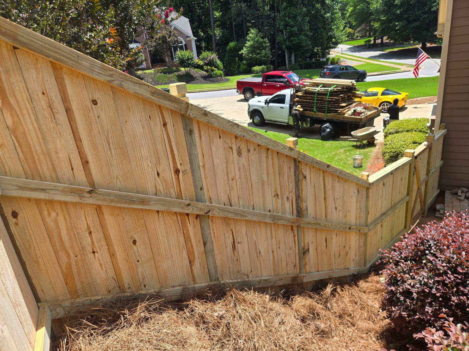 wood cap and trim fence installed by top rail fence