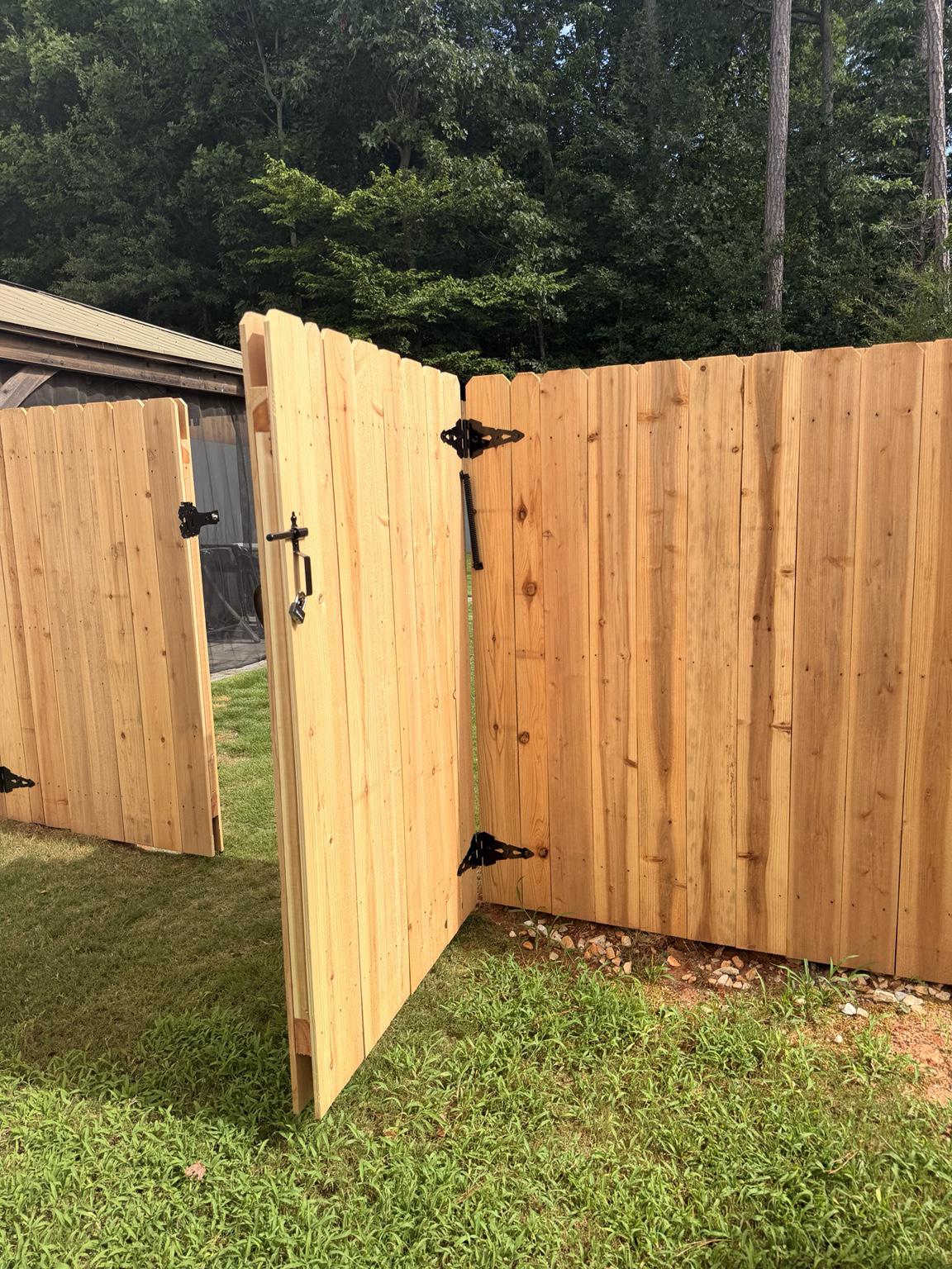 wood stockade fence installed by top rail fence