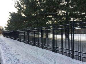 Puppy picket fence during winter time