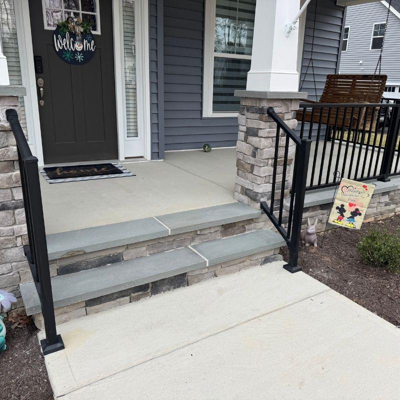Railing with stairs leading to front porch
