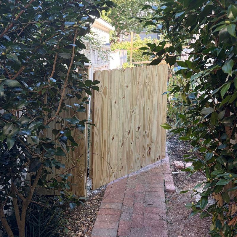 Wood stockade fence installed by Top Rail Fence