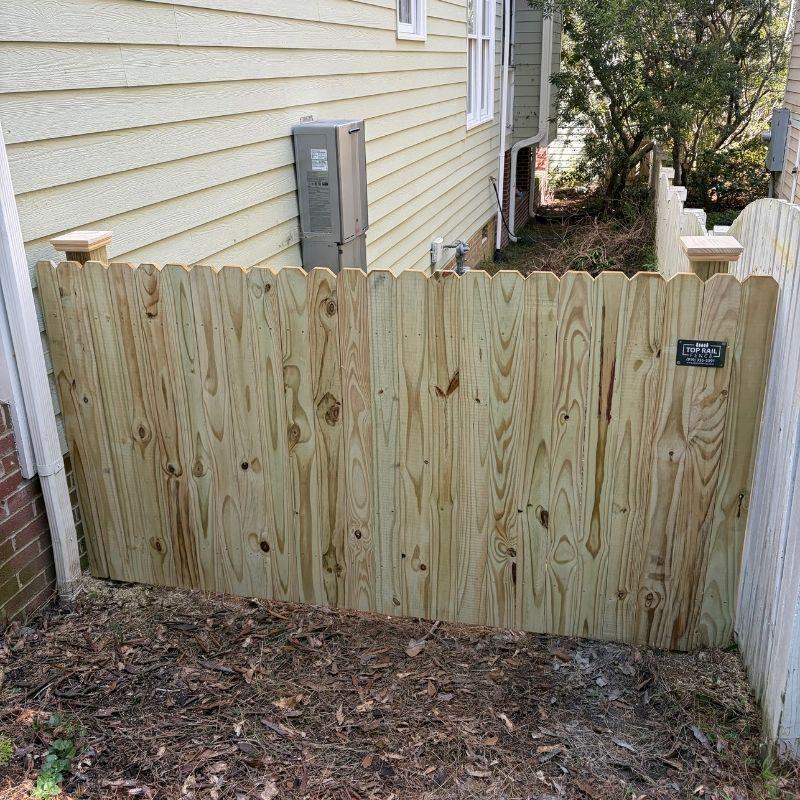 Wood stockade fence installed by Top Rail Fence