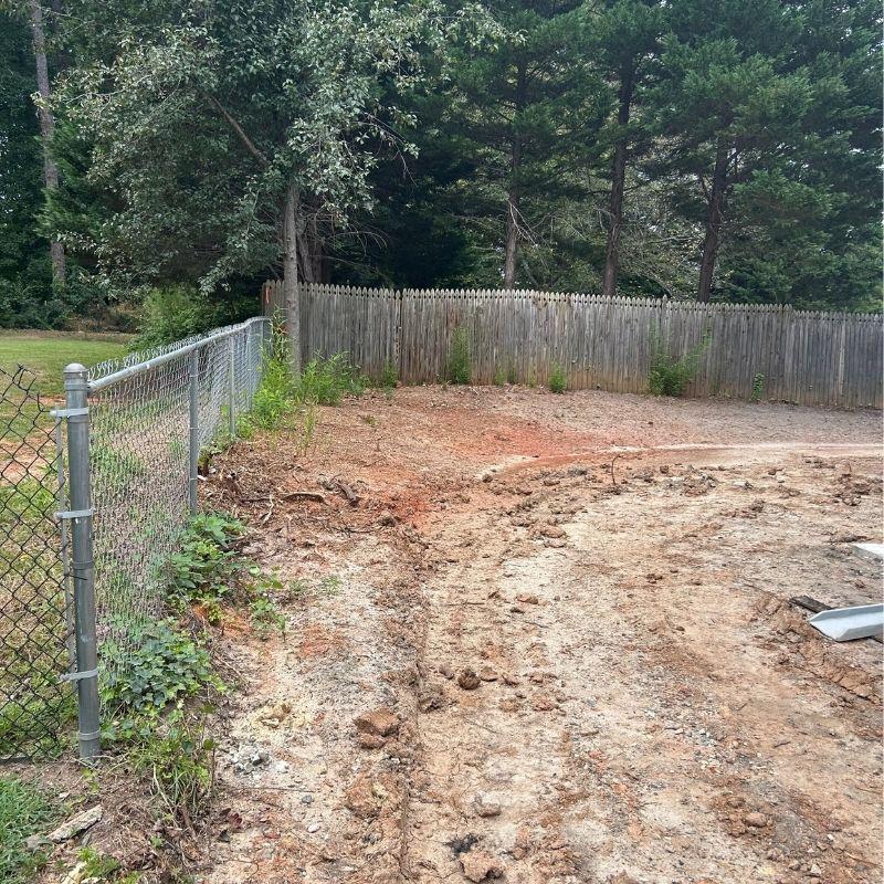 Wood and aluminum fence installed by Top Rail Fence