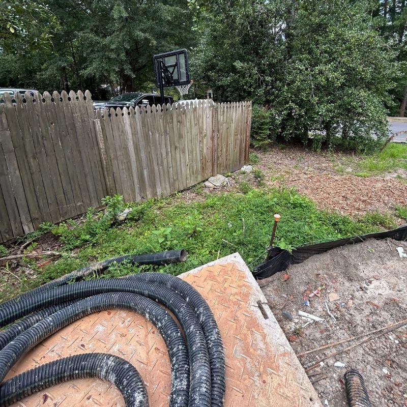 Wood and aluminum fence installed by Top Rail Fence