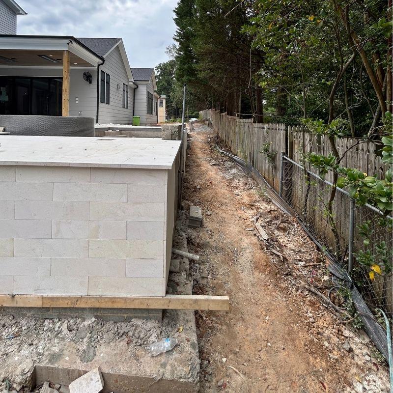 Wood and aluminum fence installed by Top Rail Fence